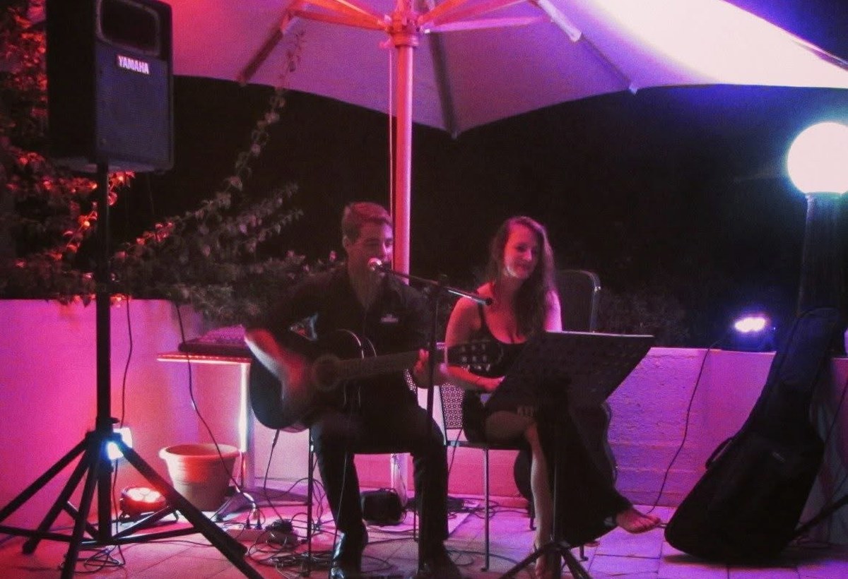 Acoustic live performance under an outdoor canopy