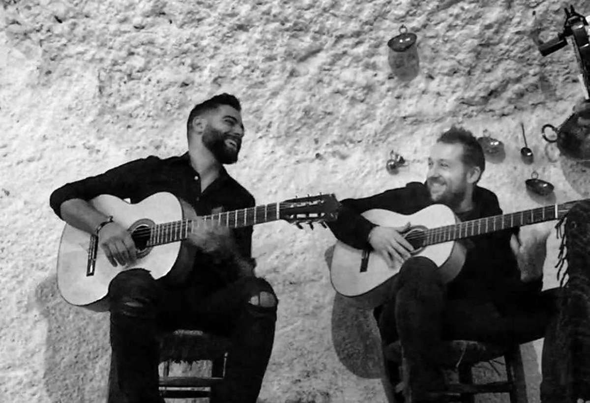 Two guitarists performing an acoustic set